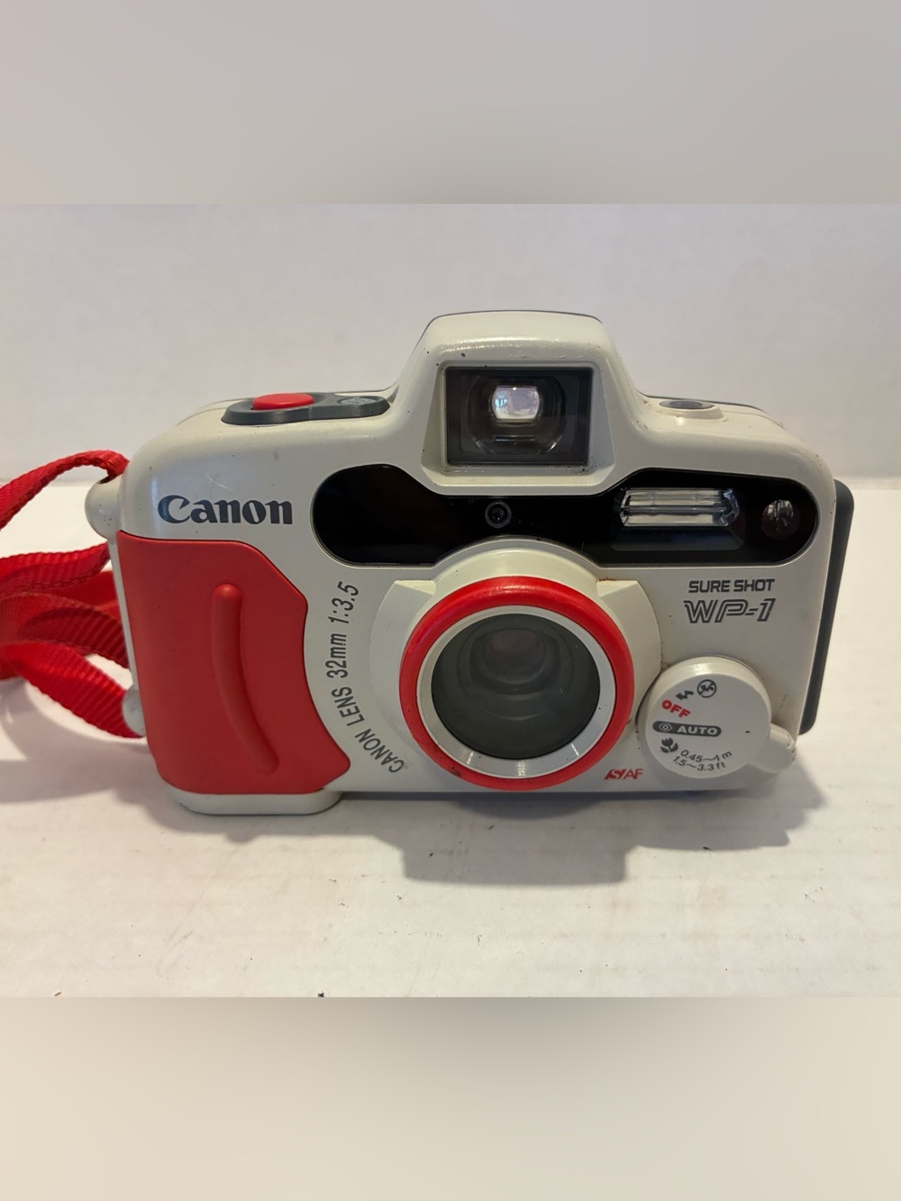 Canon Sure Shot WP-1 35mm Point-and-Shoot Camera in White & Red